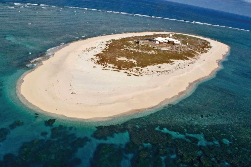 Aerial photo of weather station on Willis Island, 450 kms east of Cairns in far north Queensland in the Coral Sea