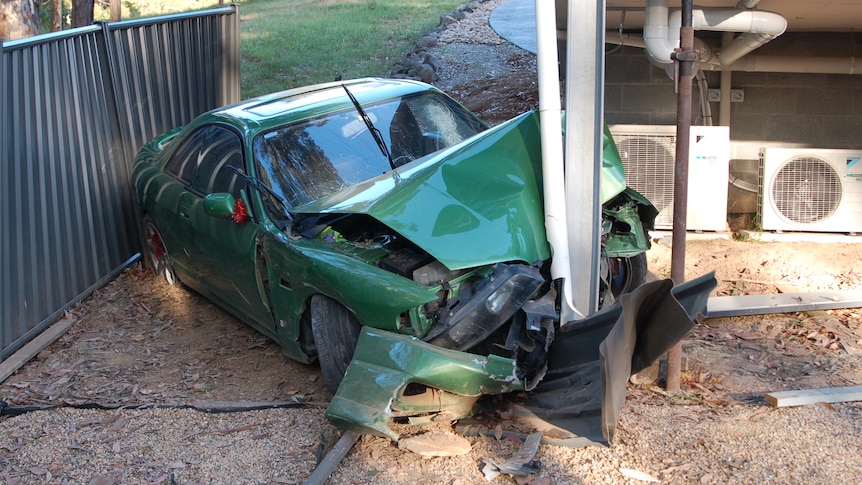 A car crashed into a metal pole.