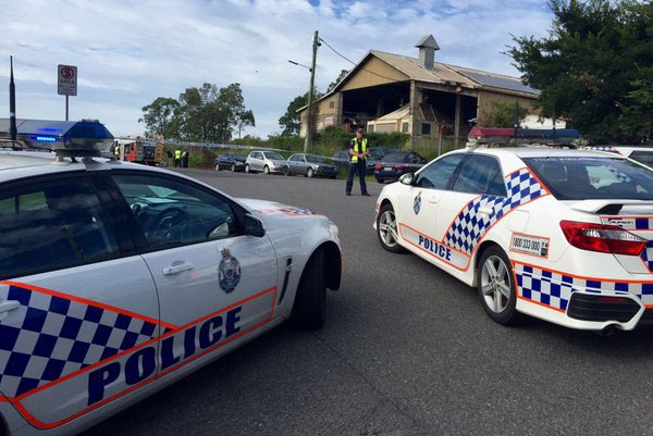 Police investigate a fatal caravan fire at the rear of a commercial property on Gravel Pit Road at Darra