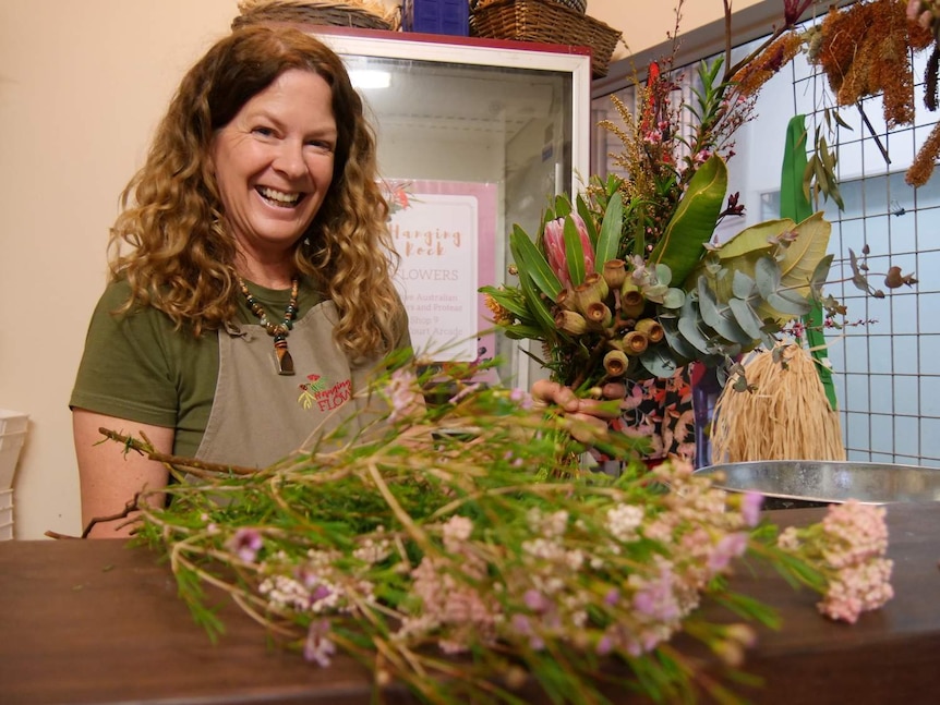 Lismore florist Linda Heilbron prepares a bouquet of flowers