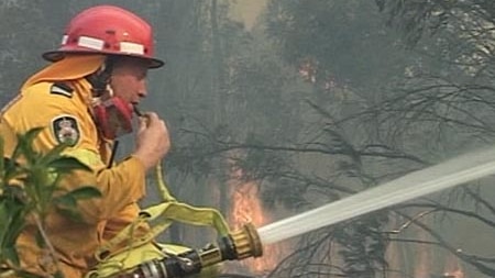 Firefighter battles a blaze