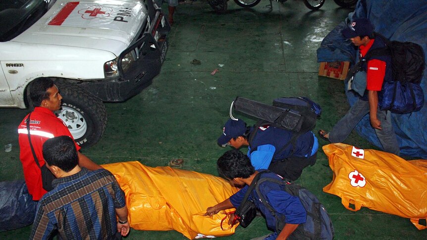 A rescue team prepares to evacuate Sumatra earthquake victims.
