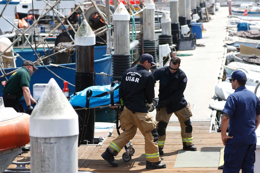 A body being brought in from a dock by the Santa Barbara Sheriffs.