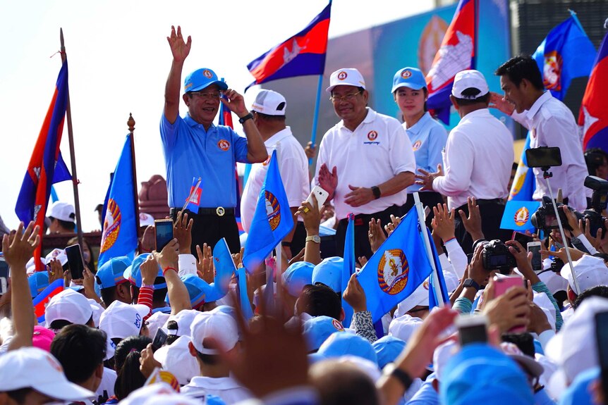 Hun Sen waves at a rally