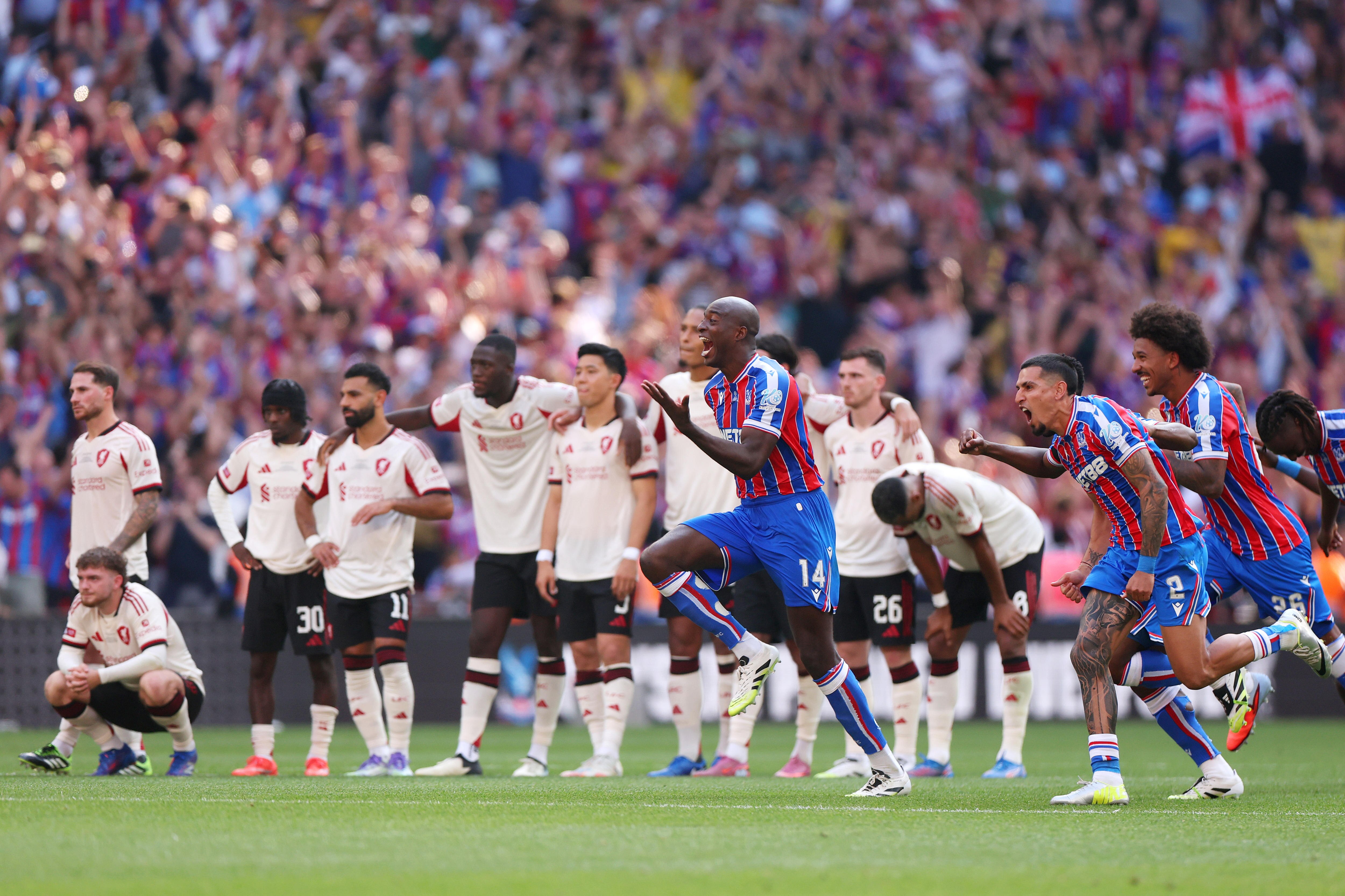 Jean-Philippe Mateta runs off in celebration as Liverpool plays look forlorn behind him