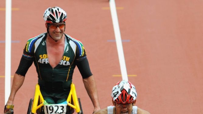Kurt Fearnley finishes first in the men's T54 marathon at the Beijing Paralympics.