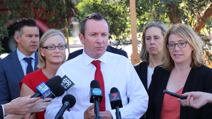 WA Premier Mark McGowan holds a roadside press conference flanked by Labors MPs and the Fremantle Mayor.