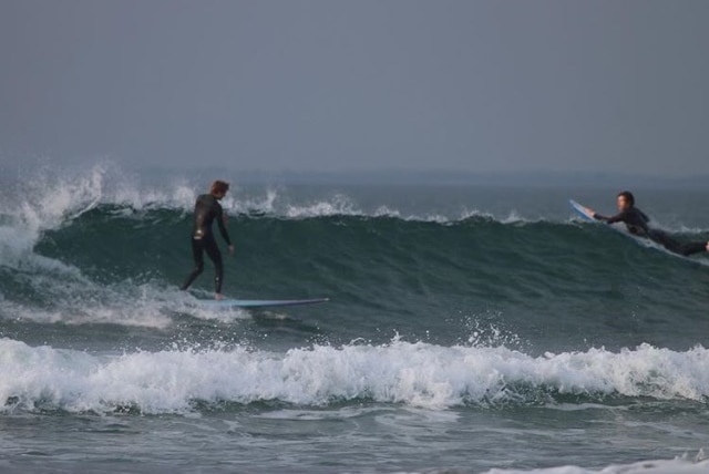 Brett Connellan surfing for the first time since he was mauled by a shark.