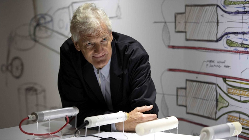 Sir James Dyson at a table