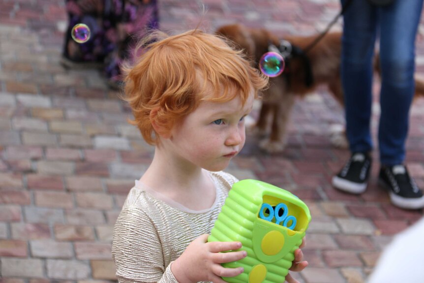 A child with red hair at the Melbourne ginger parade.