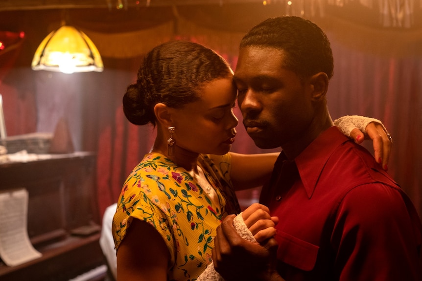 Film still of Andra Day as Billie Holiday and Trevante Rhodes as Jimmy Fletcher dancing in The United States vs Billie Holiday