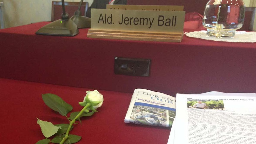 A single white rose marks the spot which Alderman Jeremy Ball occupied at the Launceston City Council.
