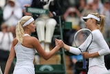 Russia's Maria Sharapova (R) shakes hands with France's Kristina Mladenovic at Wimbledon in 2013.