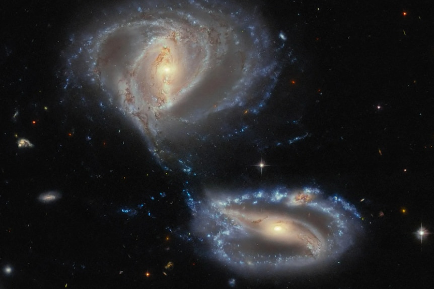 Galaxy NGC 7733 is in the bottom of the image with NGC 7734 at the top and an unidentified entity between them.