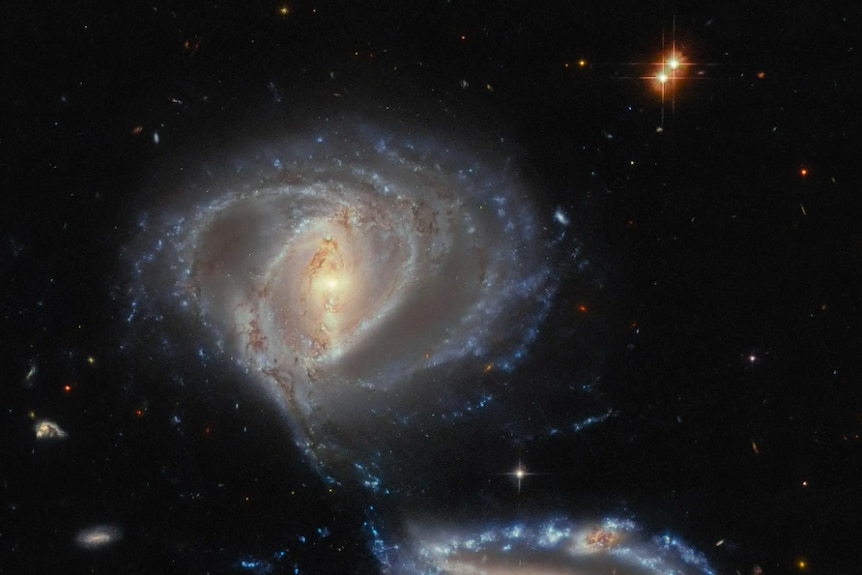 NASA's Hubble Space Telescope captures the dance of interacting galaxies in Arp-Madore 2339-661 (NGC 7733, NGC 7734).