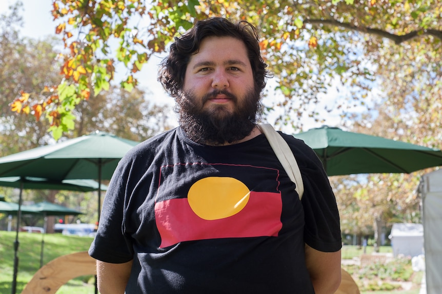 Young Aboriginal man Dominic Guerrera wears and Aboriginal