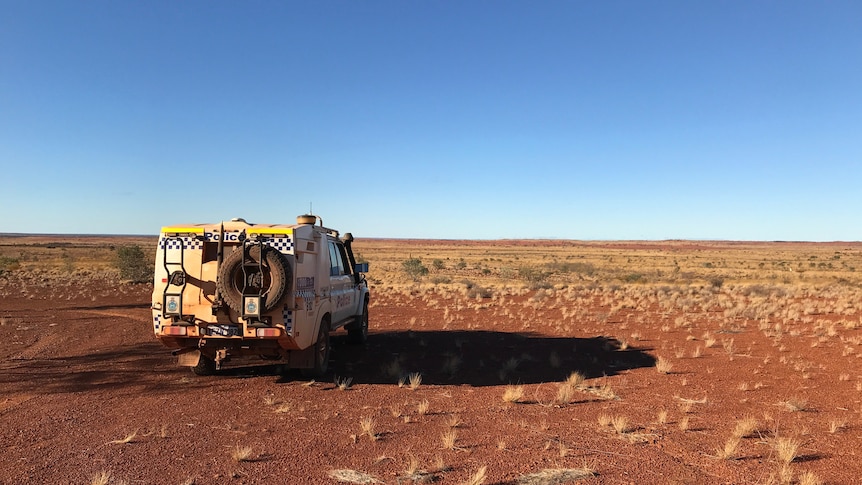 A police car in the remote outback.  