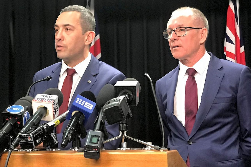 Tom Koutsantonis and Jay Weatherill at a podium.