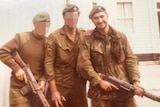 Three SAS soldiers in uniform, two with faces blurred, holding weapons.