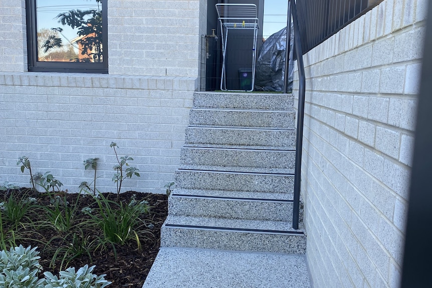 A staircase with a handrail