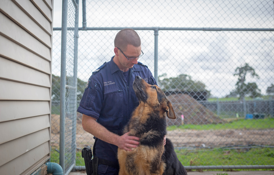 Senior Constable Mark Gray with Victoria Police dog Diesel.