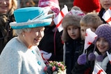 Britain's Queen Elizabeth II meets children on the 60th anniversary of her accession to the throne