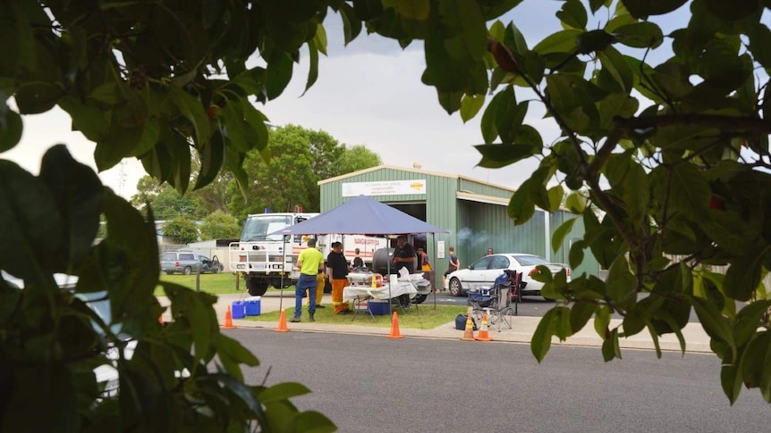 Stuart Thomson's smoker and marquee stand on the lawn of the Nangwarry CFS serving customers.