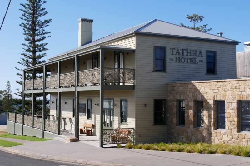 A sunny photo of an old country pub.