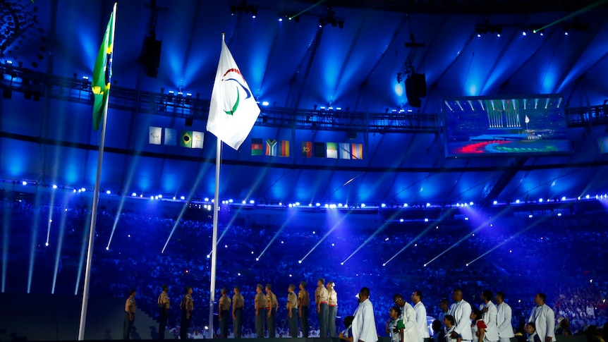 The Brazilian and Paralympic flags fly side-by-side at the Rio opening ceremony