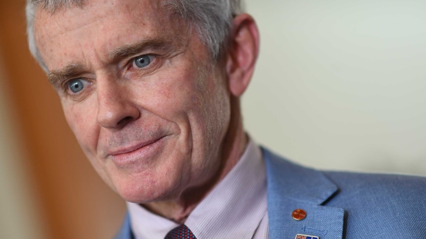 Malcolm Roberts reacts during a press conference at Parliament House in Canberra.