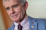 Malcolm Roberts reacts during a press conference at Parliament House in Canberra.