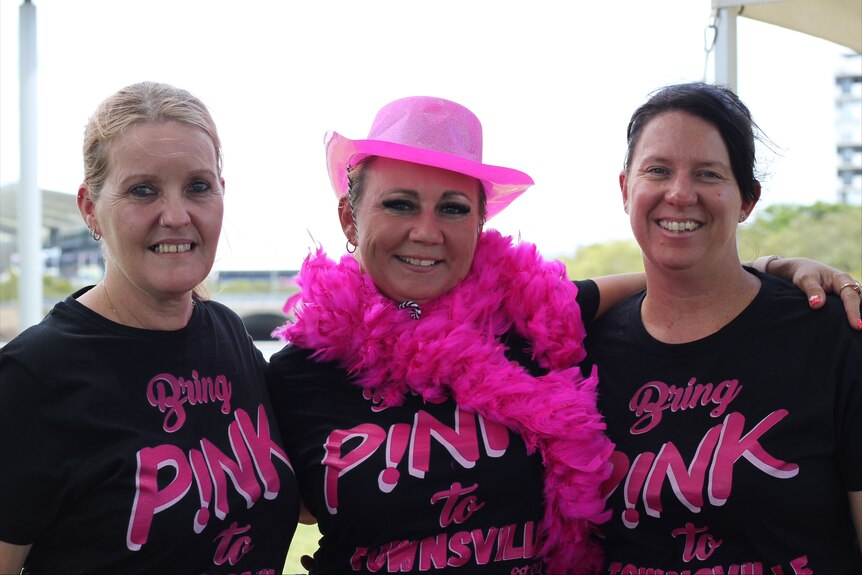 Three women , wearing Bring Pink to Townsville T-shirts.