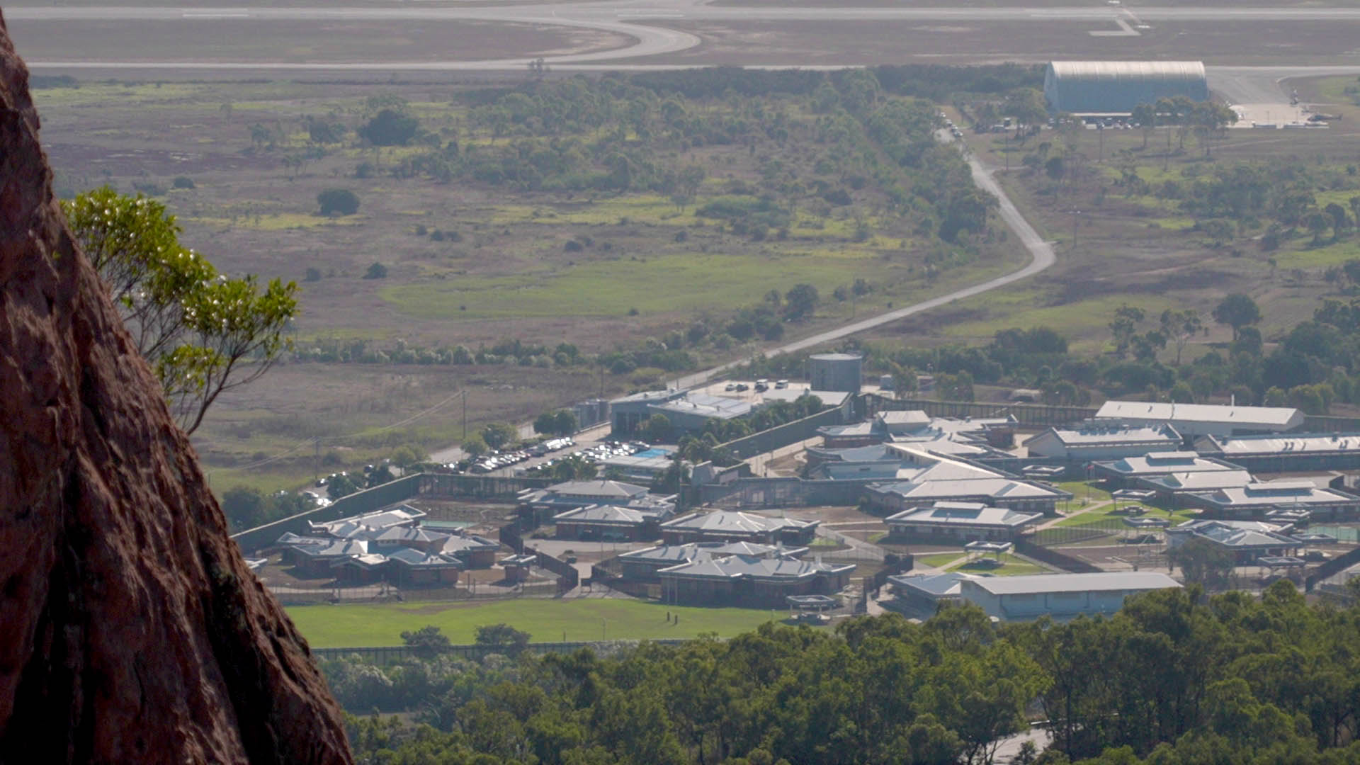 Looking down from a hill to the rooves of numerous buildings that make up Cleveland detention centre