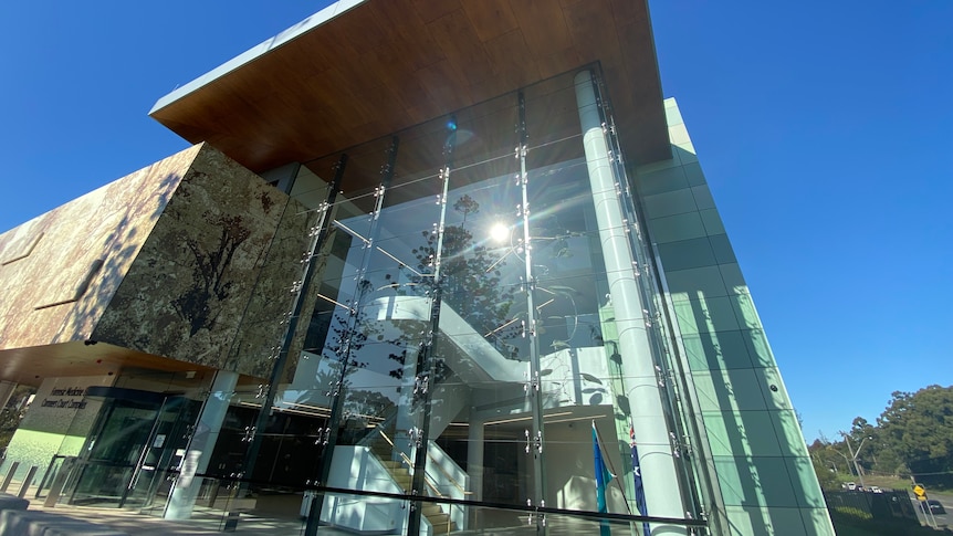 A building with tall glass windows.