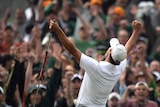 Adam Scott celebrates his win on the 10th hole during a play-off with Angel Cabrera