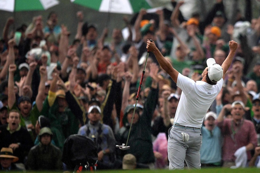 Adam Scott of Australia celebrates his win on the 10th hole during a play-off with Angel Cabrera of Argentina.