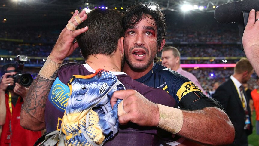 Johnathan Thurston of the Cowboys consoles with Ben Hunt of the Broncos after the 2015 NRL Grand Final