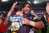 Johnathan Thurston of the Cowboys consoles with Ben Hunt of the Broncos after the 2015 NRL Grand Final