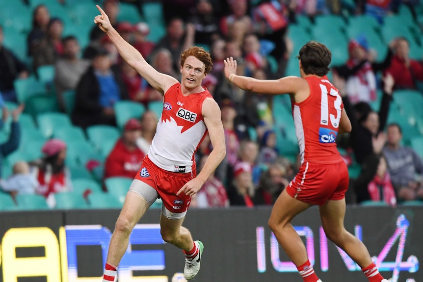 Sydney's Gary Rohan (L) celebrates a goal against Gold Coast at the SCG on July 8, 2017.