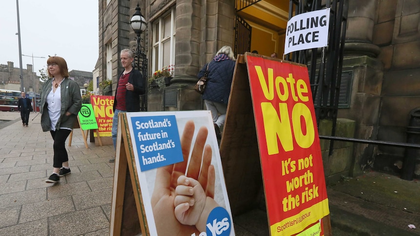 Voters leave a polling station during the initial referendum on Scottish independence in 2014.
