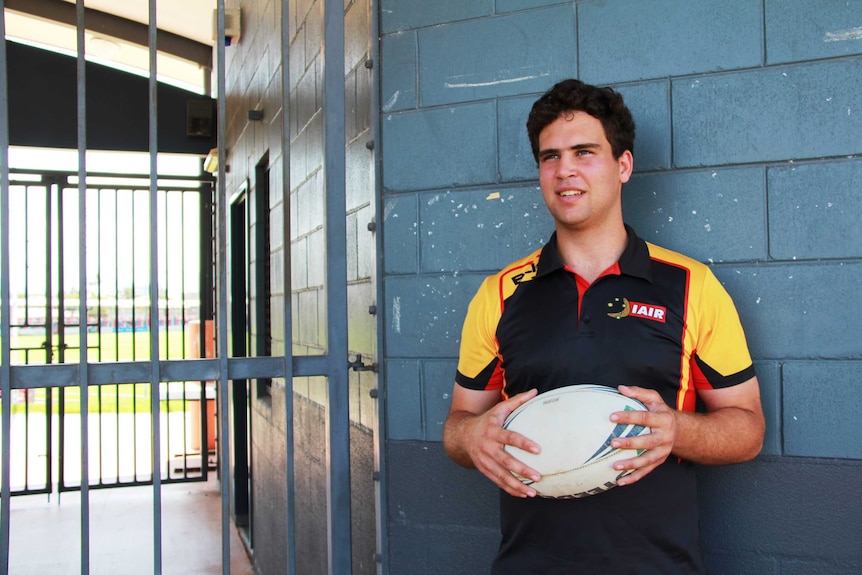 Elliott Thompson standing at the entrance to Browne Park in Rockhampton.