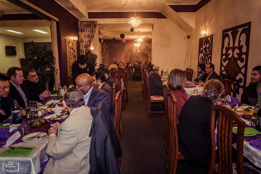 Annual dinner hosted by AMAFHH, people are gathered together to break fast. 