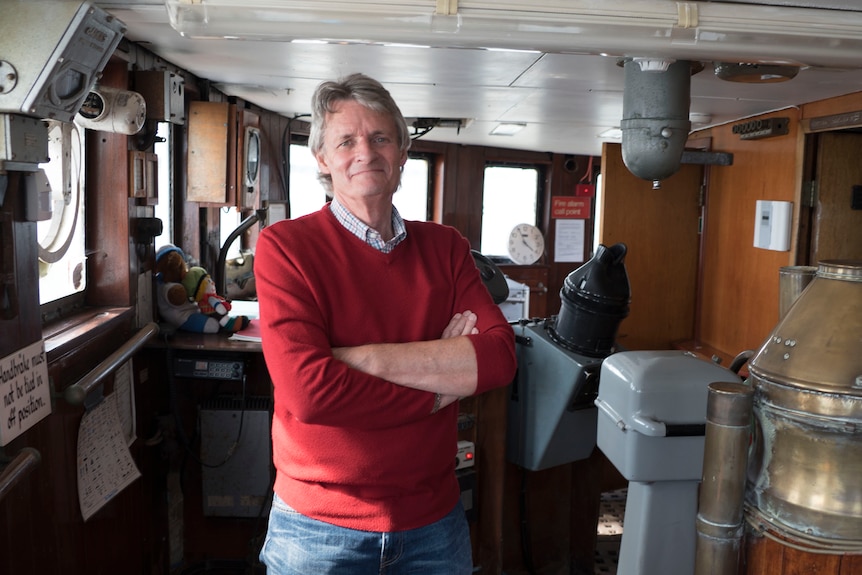 Steve Anthony poses for photo inside ship.