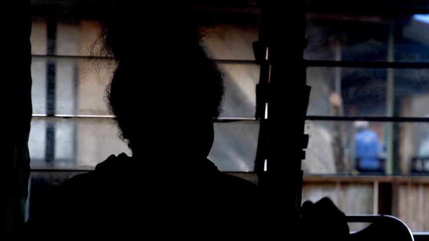West Papuan activist Yosina in silhouette.