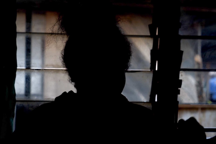 West Papuan activist Yosina in silhouette.