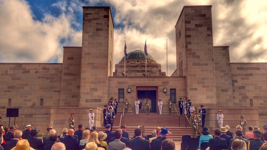 Hundreds of people gather in front of the Australian War Memorial in Canberra.