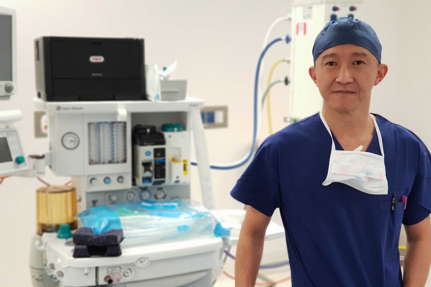 Dr Donald Kuah in scrubs standing in an operating theatre