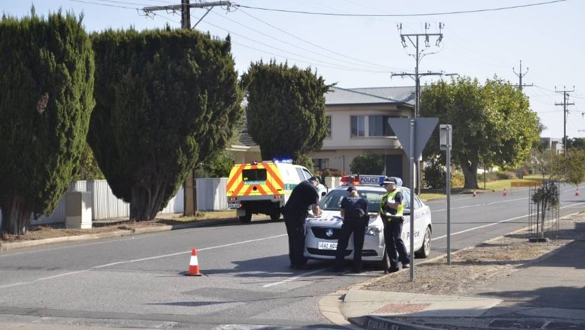 Police assessing the scene of a car crash in Victor Harbor