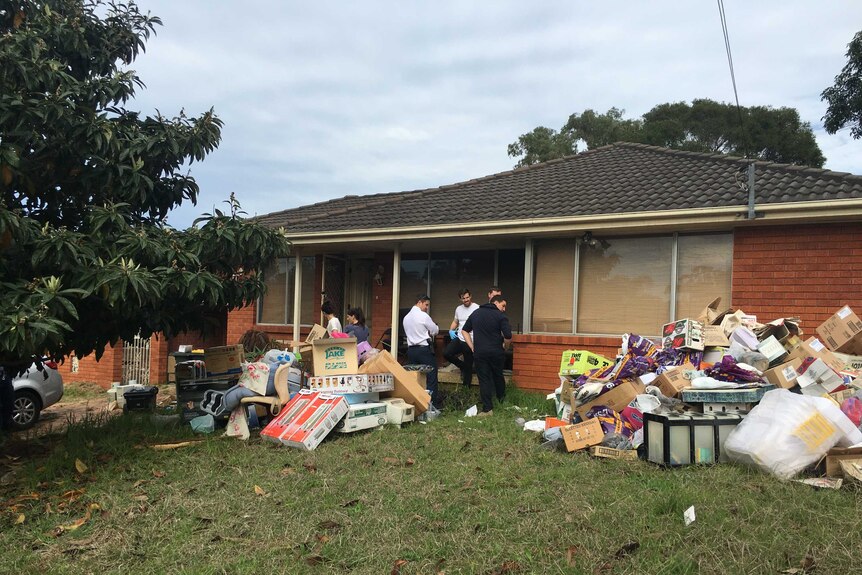 Police remove rubbish at the home of Peter Zhurawel at Greystanes in Sydney's west