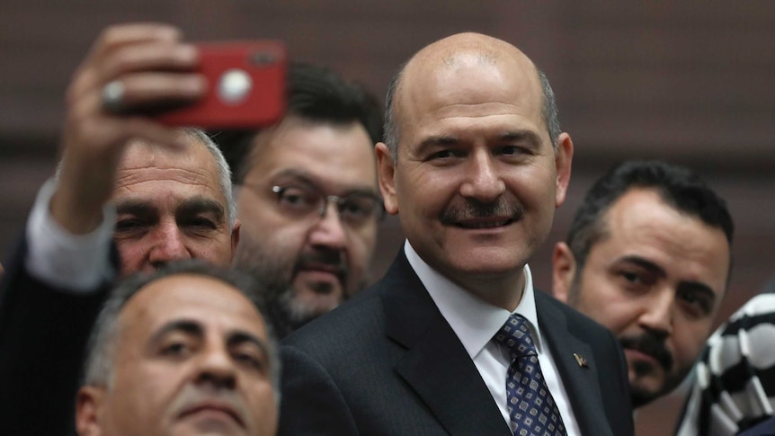 Turkey's former Interior Minister Suleyman Soylu poses for a selfie.